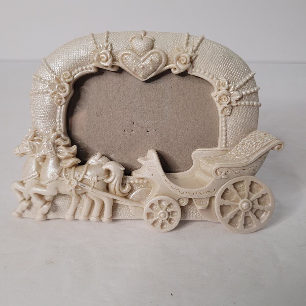 10 boxes of Cinderella Carriage Photo Frames.